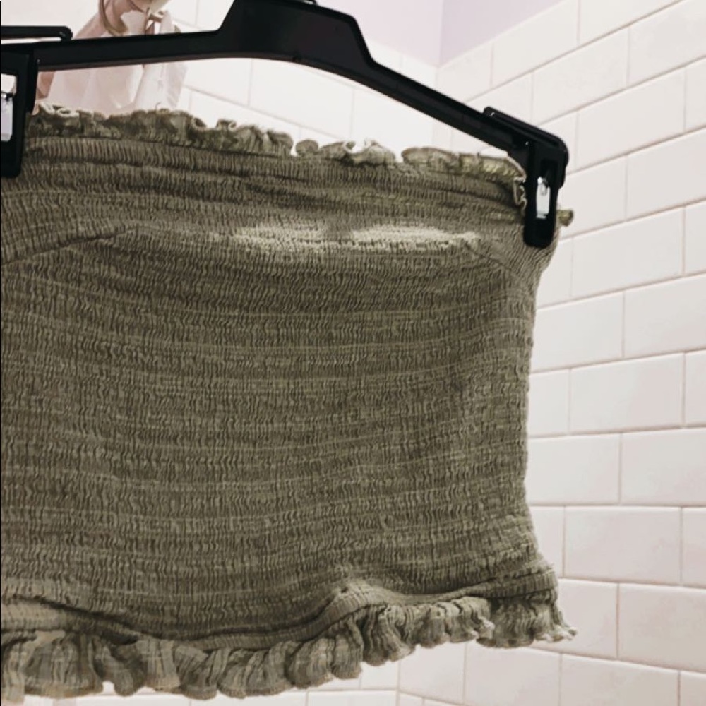 a bright green frilly urban outfitters tube top